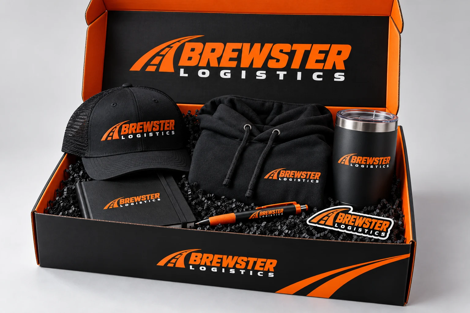 Brewster Logistics branded appreciation swag box with apparel and useful gifts